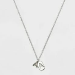 Budget 🔔 Crystal Sterling Plated Initial Tag Cut Out Pendant Necklace - A New Day™ Metallic Silver ⭐